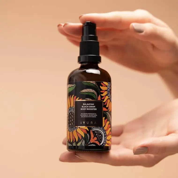 The bottle held in two hands