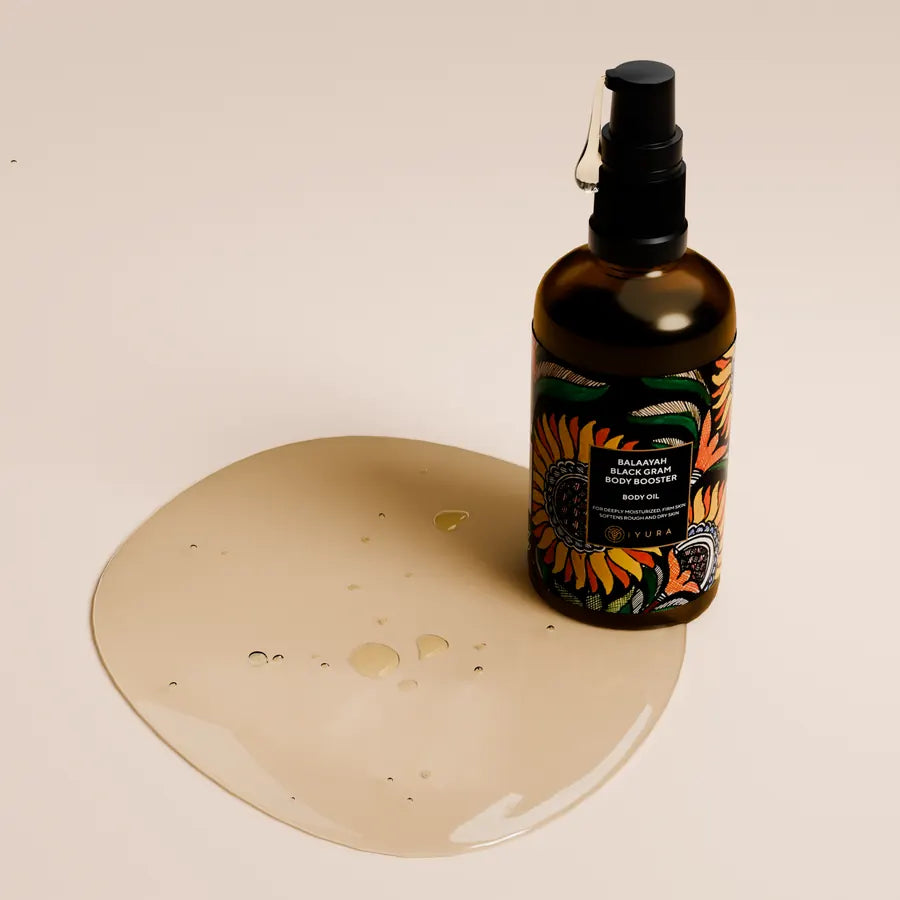 The bottle beside a pool of golden oil